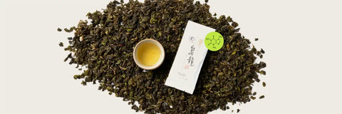 Oolong tea leaves with brewed cup showing typical oolong tea caffeine content